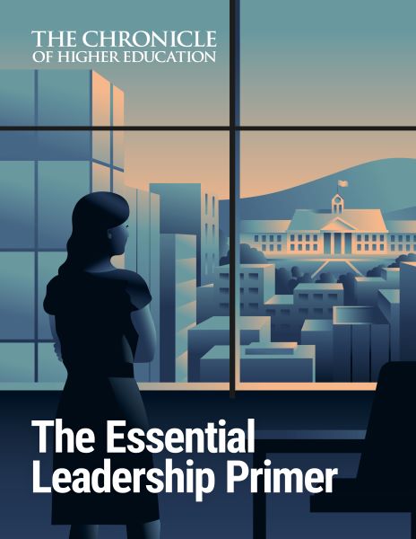 The Essential Leadership Primer - image of a woman looking at a big window overlooking a city with a university building in the distance